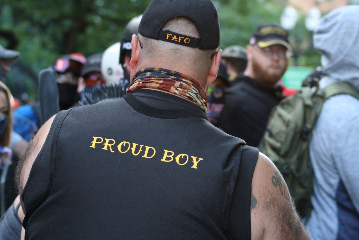 'Idiot': Guns pulled as Proud Boys and antifascists clash in park