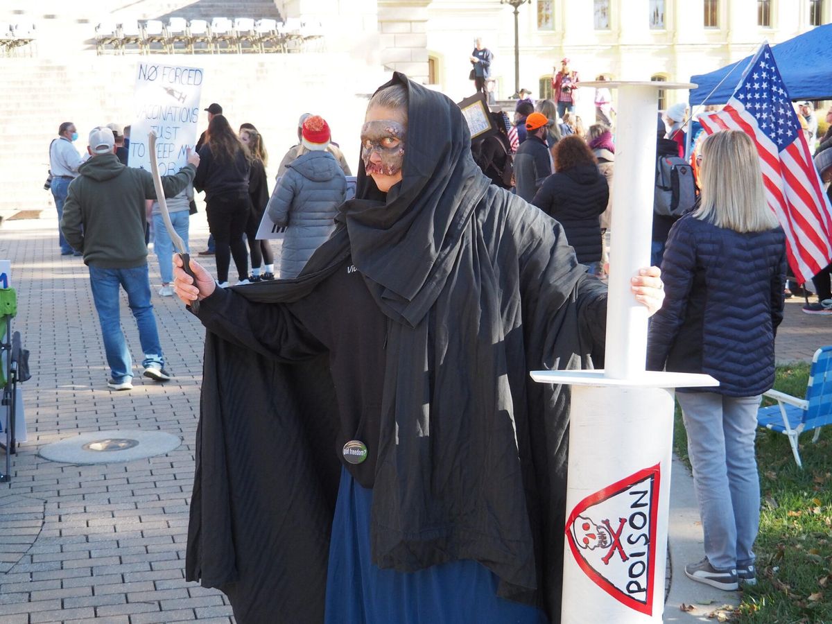 Grim Reaper of COVID-19 vaccine skeptics takes swipe at government, drug companies and the media