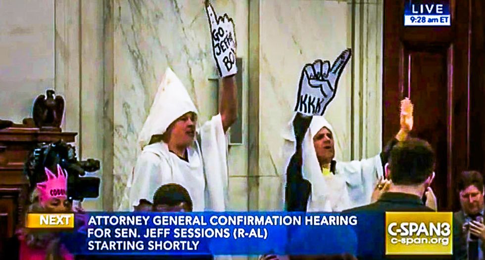 'You can't arrest me -- I'm white!': Protesters dressed as Klansmen ejected from Sessions hearing