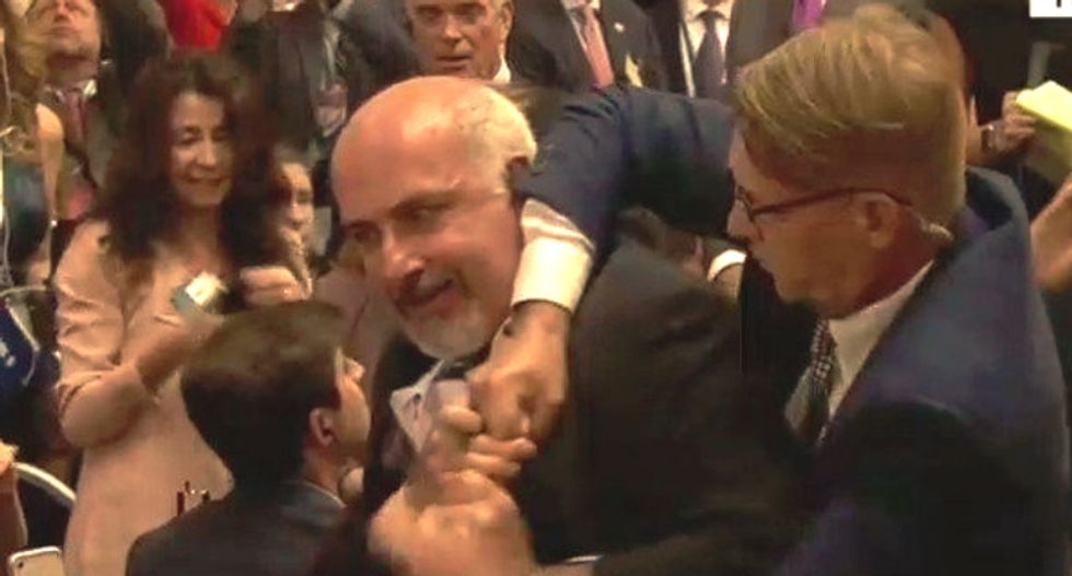 WATCH: Man claiming to be with a progressive news org hauled out of Trump-Putin presser in Helsinki