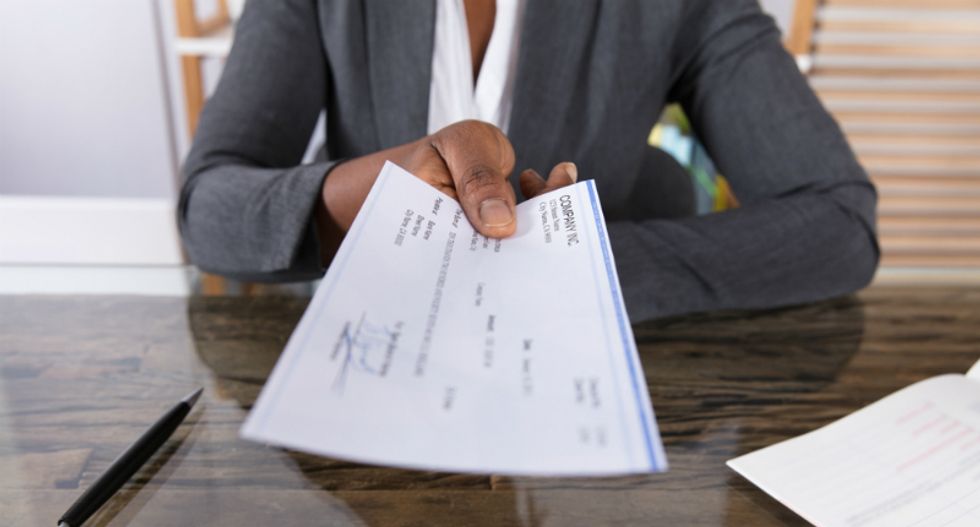Wells Fargo tellers call the cops on elderly black bank manager for attempting to cash a check