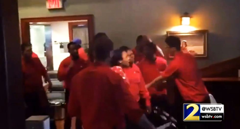 Watch all hell break loose at Georgia steakhouse after customer punches busboy for smiling