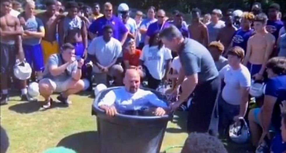 Georgia school district repudiates 'bizarre' mass baptisms on football field