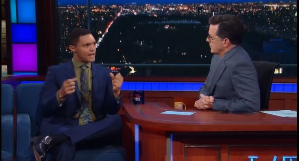 Trevor Noah and Stephen Colbert urge Americans to 'unite under the banner of human' after baseball rampage