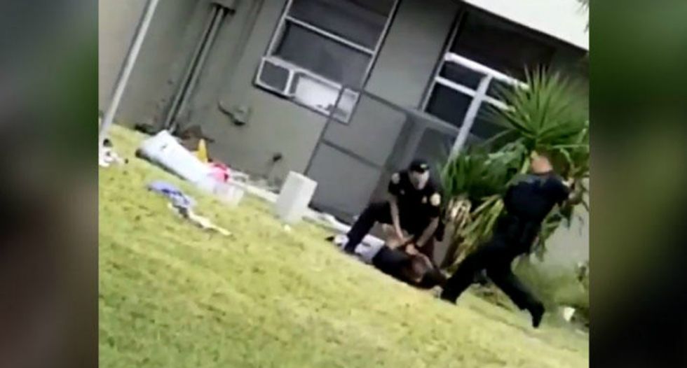 Miami cop 'relieved of duty' hours after being caught on video kicking a handcuffed man in the head
