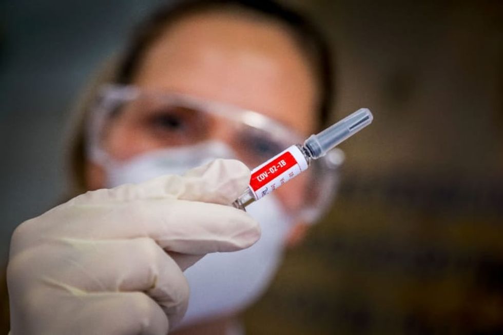 Rich nations snap up vaccine stocks in global race for jab