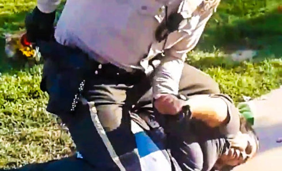 WATCH: California cop grabs woman selling flowers by the hair and slams her into the pavement