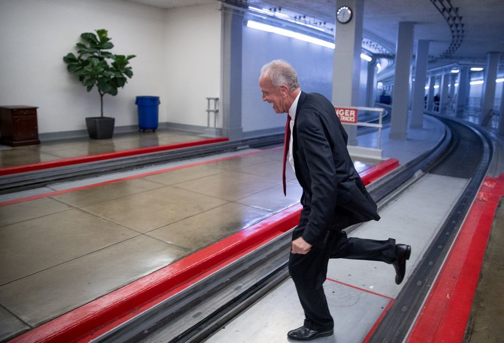 GOP senator jumps over subway tracks to avoid press after he sinks healthcare bill