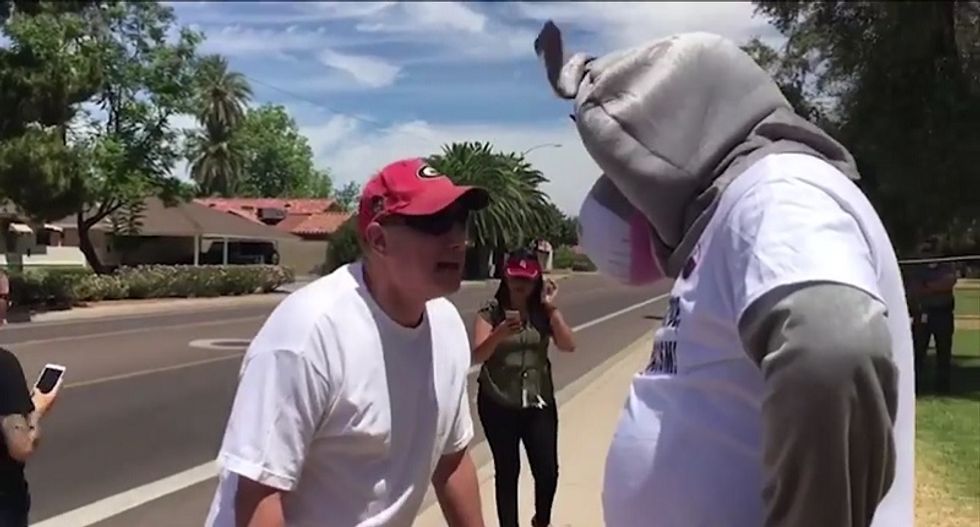 Trump supporter confronts protester in donkey costume: 'Is that a burka?'