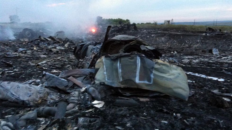 Two Australians on downed Malaysia Airlines flight had lost relatives on missing flight MH370