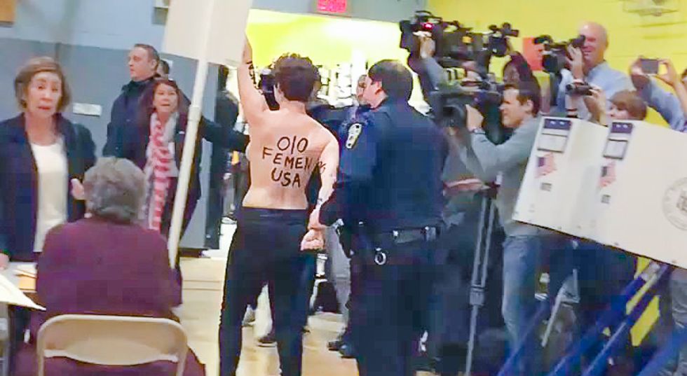 WATCH: Police arrest topless activists for protesting inside Donald Trump's polling place