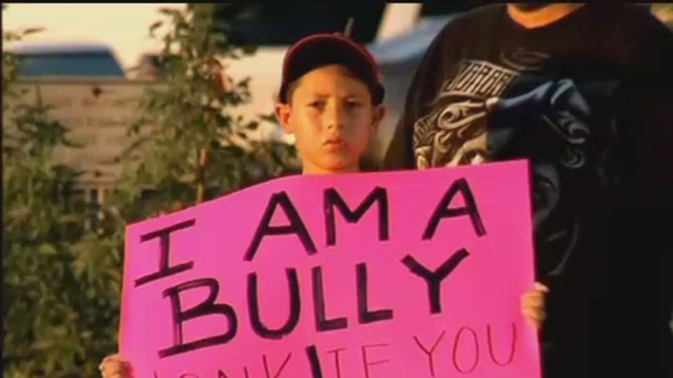 Father forces son to hold pink 'I am a bully' sign on Texas highway
