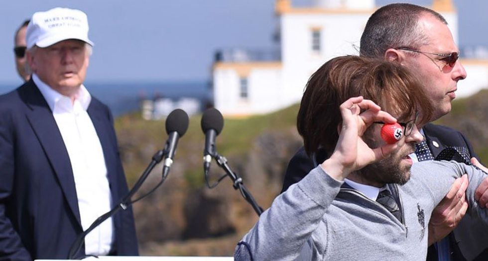 WATCH: Protester hurls swastika golf balls at Trump during Scotland news conference
