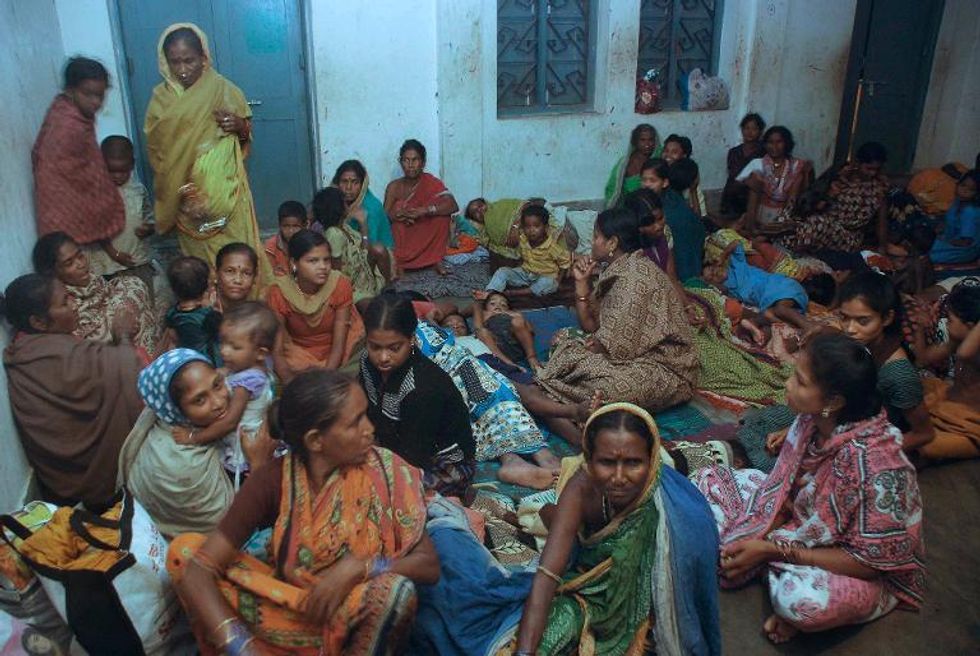 Up to 12 million people face mass disruption as Indian Cyclone Phailin makes landfall