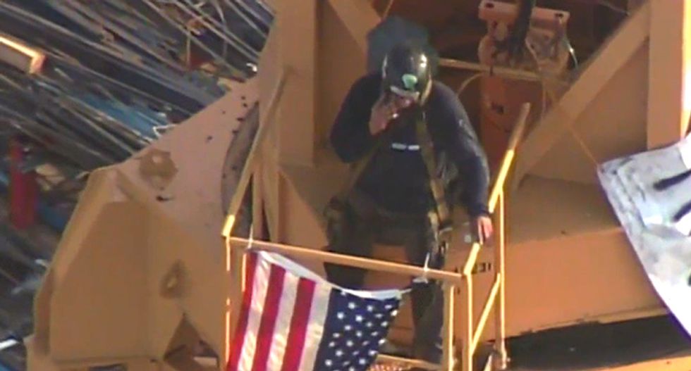 Protester climbs on top of crane ahead of Trump’s speech in Florida