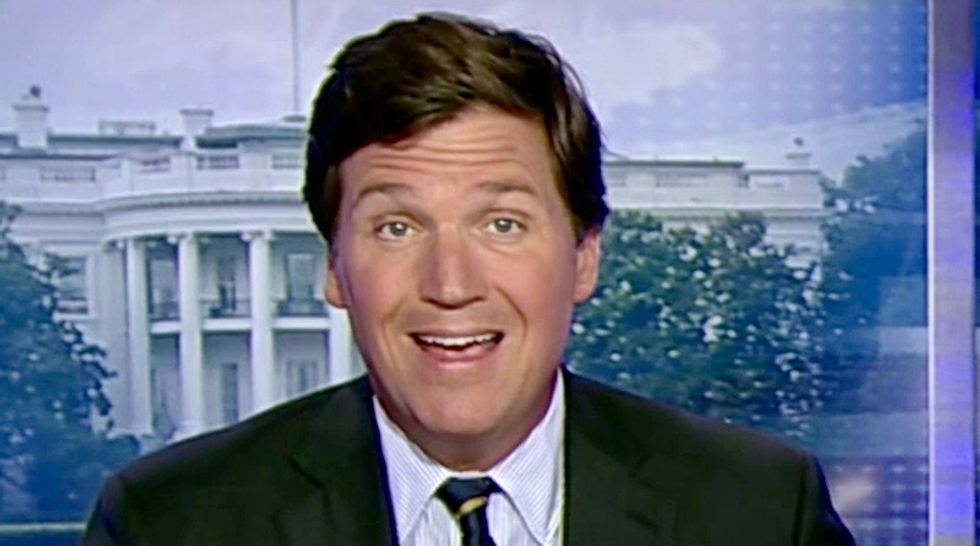 Tucker Carlson announces 'long-planned' vacation following his top writer's resignation for racism