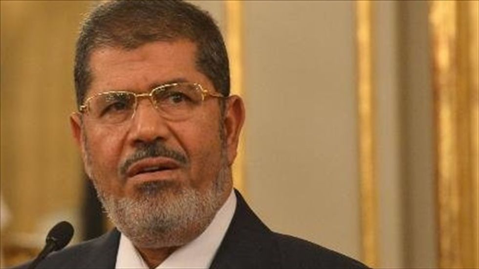 Egypt's ousted President Mohammed  Morsi collapses and dies in court, state TV says