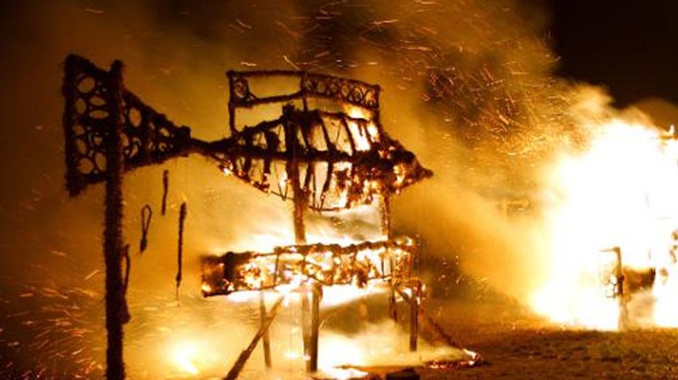 Lithuanians burn down straw village in autumn rite