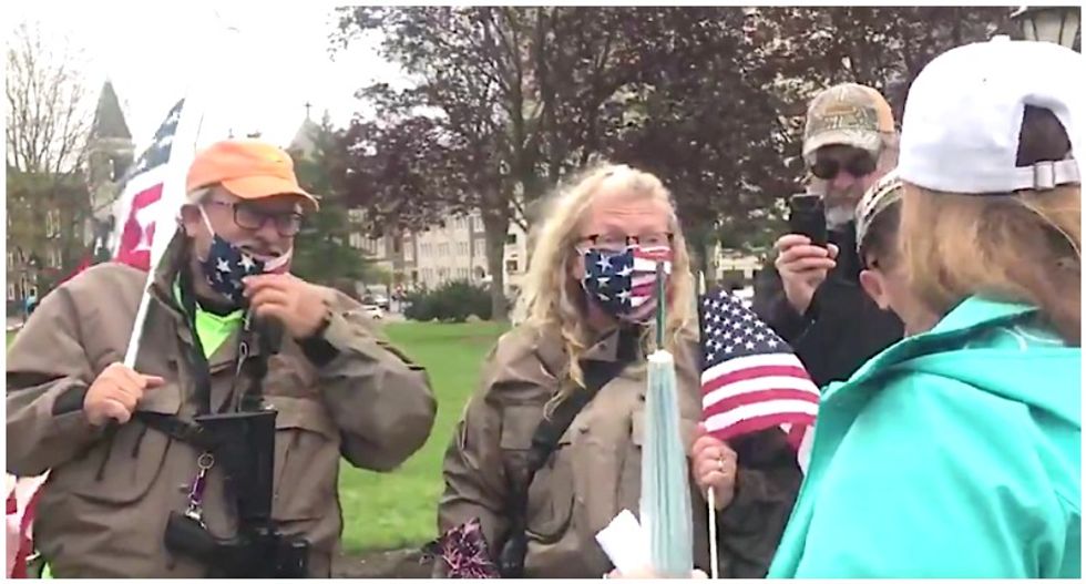 ‘You callin' me an idiot?’ Protesters caught on video bickering over bringing guns to Michigan anti-lockdown protest