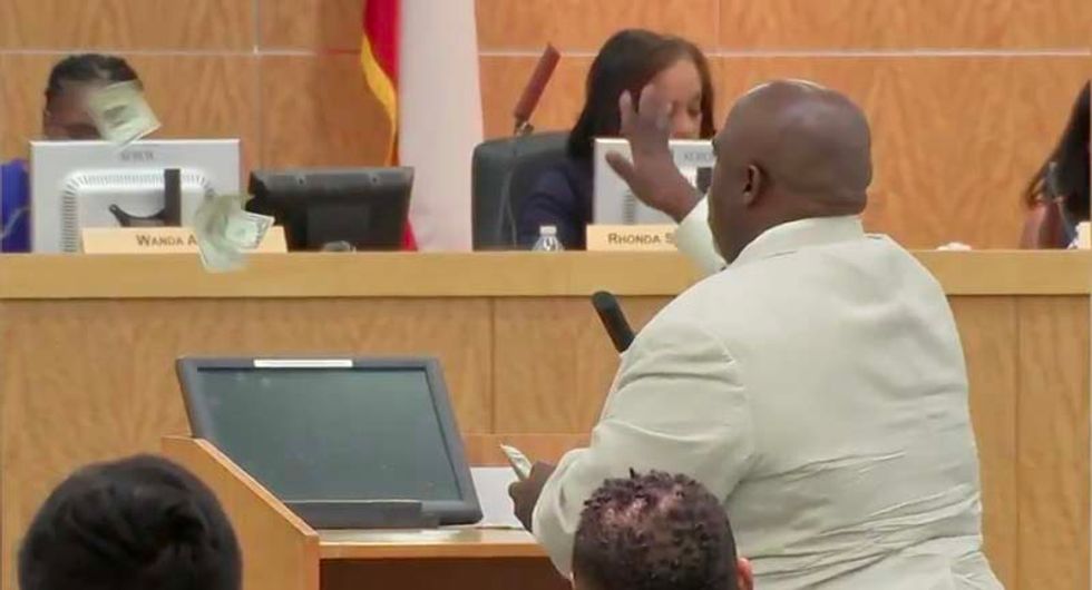 'You don’t care about those kids!’: Watch Houston activist throw cash at school board members only interested in salaries
