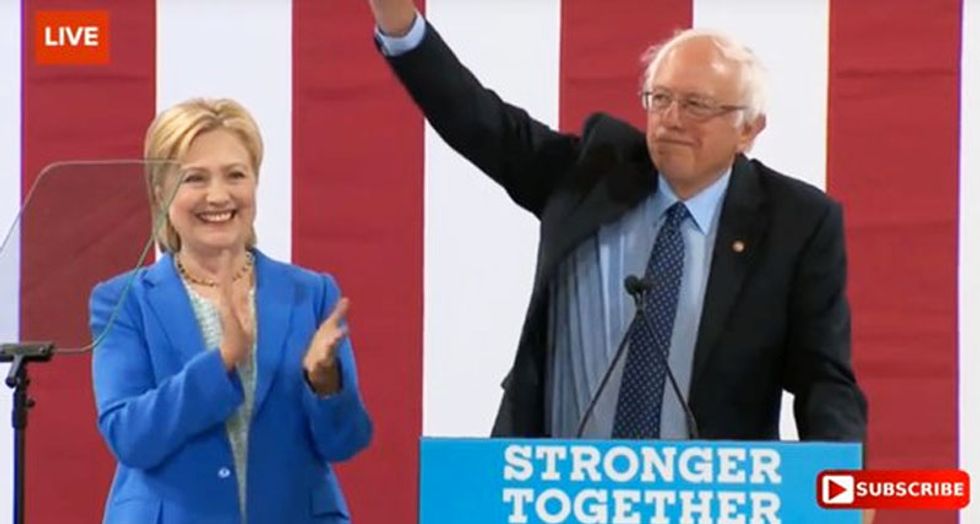 Bernie Sanders throws support behind Hillary Clinton at raucous New Hampshire rally