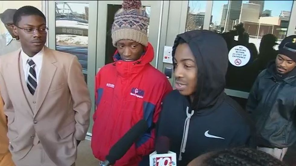 Three black students waiting for bus arrested after cops order them to 'disperse'