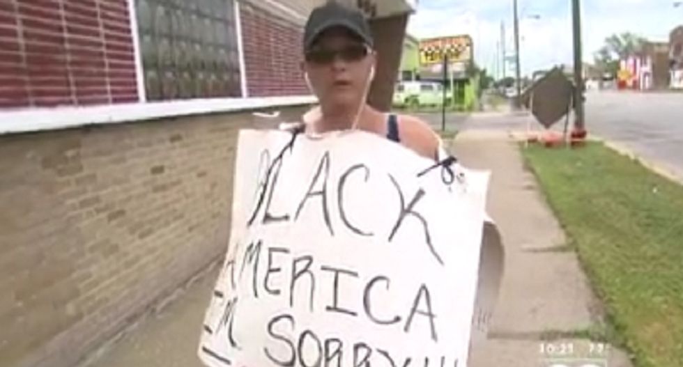 White woman walks through Chicago's South Side wearing 'Black America, I'm sorry' sign