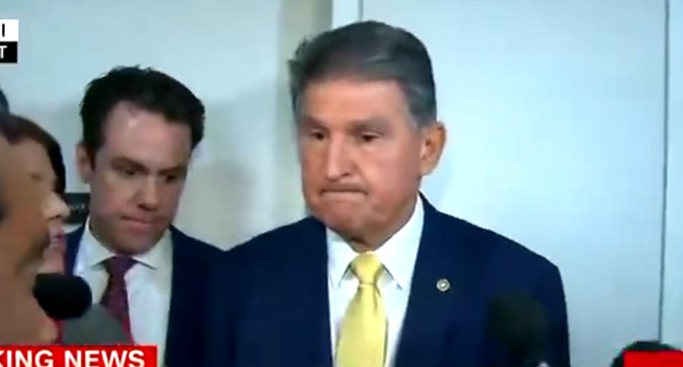 'Shame on you!' Protesters completely drown out Joe Manchin in dramatic CNN video
