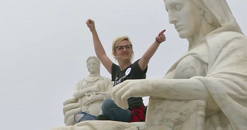 Watch: Anti-Kavanaugh protestors storm the stairs of the Supreme Court and slam the doors during swearing-in