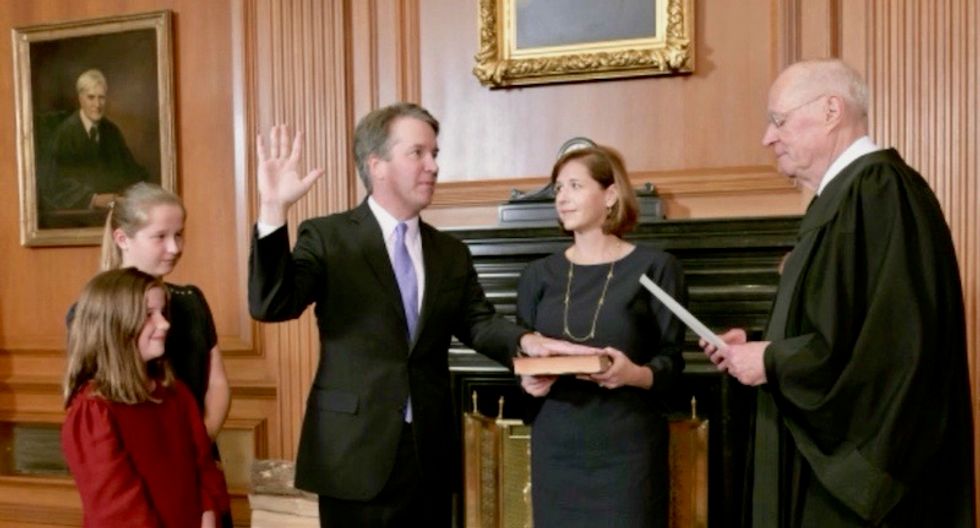 Brett Kavanaugh sworn onto Supreme Court with wife and daughters at his side