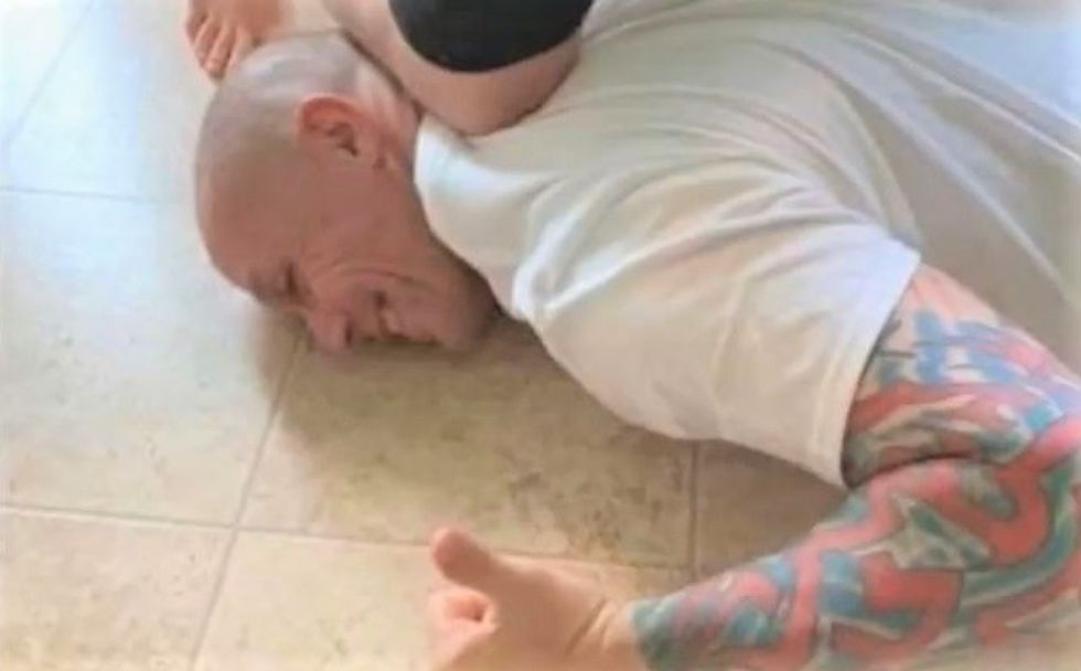 High school wrestling coach posted photo that mocked George Floyd's death -- but insists 'I'm not a racist'