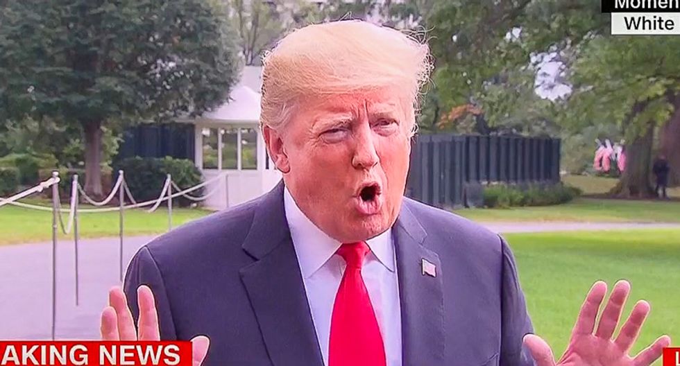 Trump randomly blames China after he’s asked if he believes in global warming