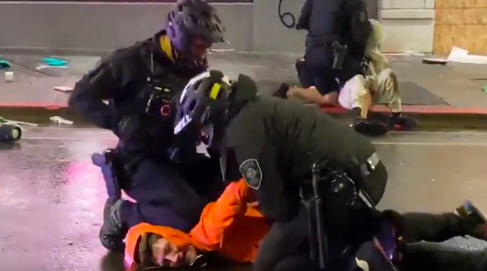 Seattle cop caught on video with knee on neck of George Floyd protestor