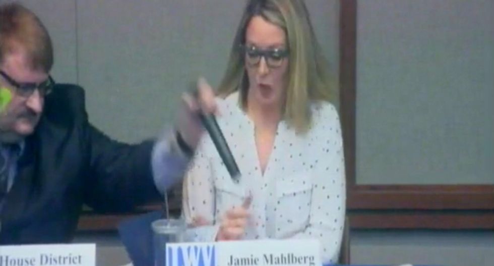 WATCH: GOP state legislator snatches mic from the hand of his female opponent — then throws it back at her during debate