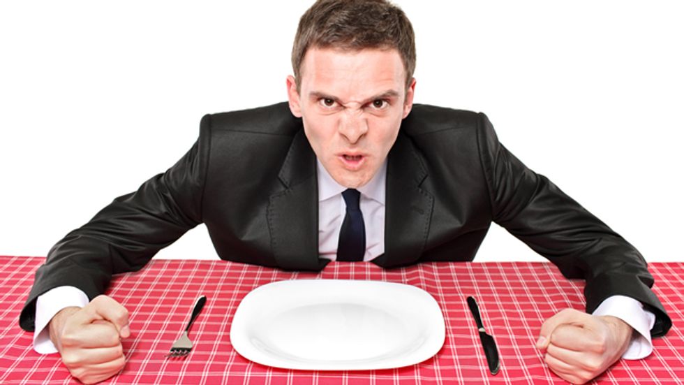 Anti-gay bar patrons leave bigoted message for their waiter -- and the restaurant fired him