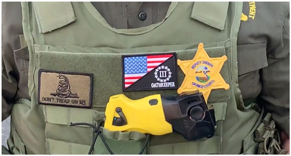 Deputy gets called out after sporting 'extremist' symbols at Black Lives Matter protest – and then gets put on leave