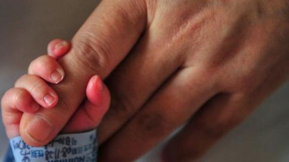 Chinese woman gave birth to twins at 60: report