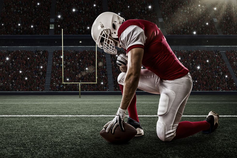Parents infuriated after football coach directs players to mock student with gay parents