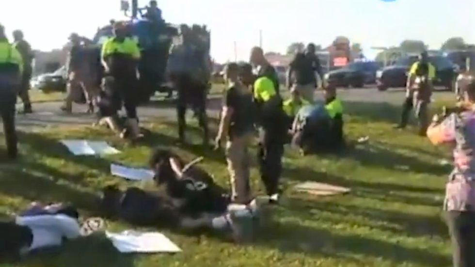 WATCH: Cops arrest black journalist covering protest -- even after he repeatedly identifies himself as press