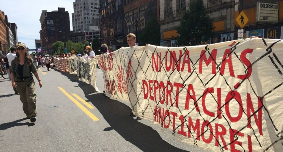 Anti-Trump protesters unfurl their own 'wall' at the Republican National Convention