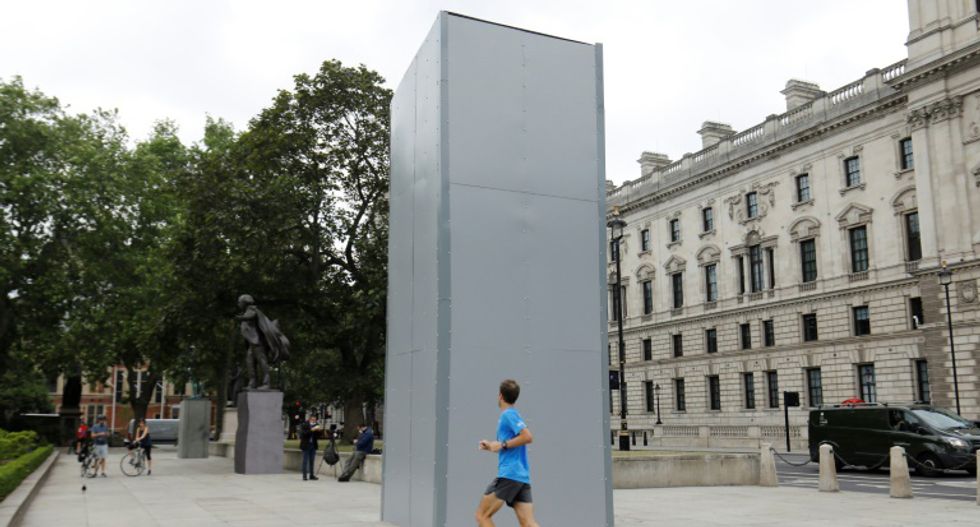 Boris Johnson defends England's racist past as UK boards up statues to protect them from protesters
