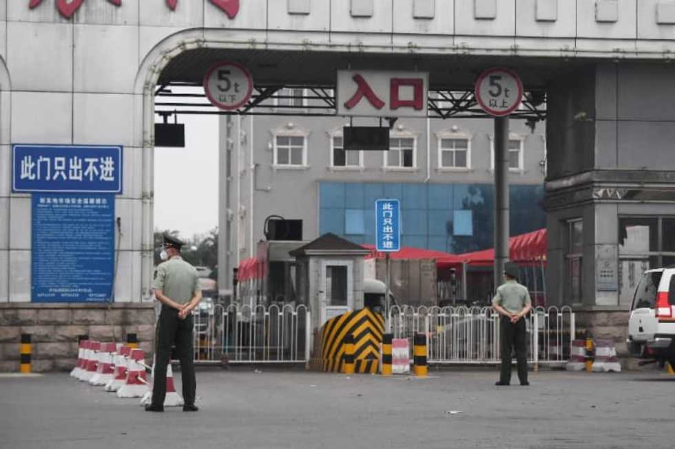 Mass virus testing in Beijing after new cluster triggers lockdowns