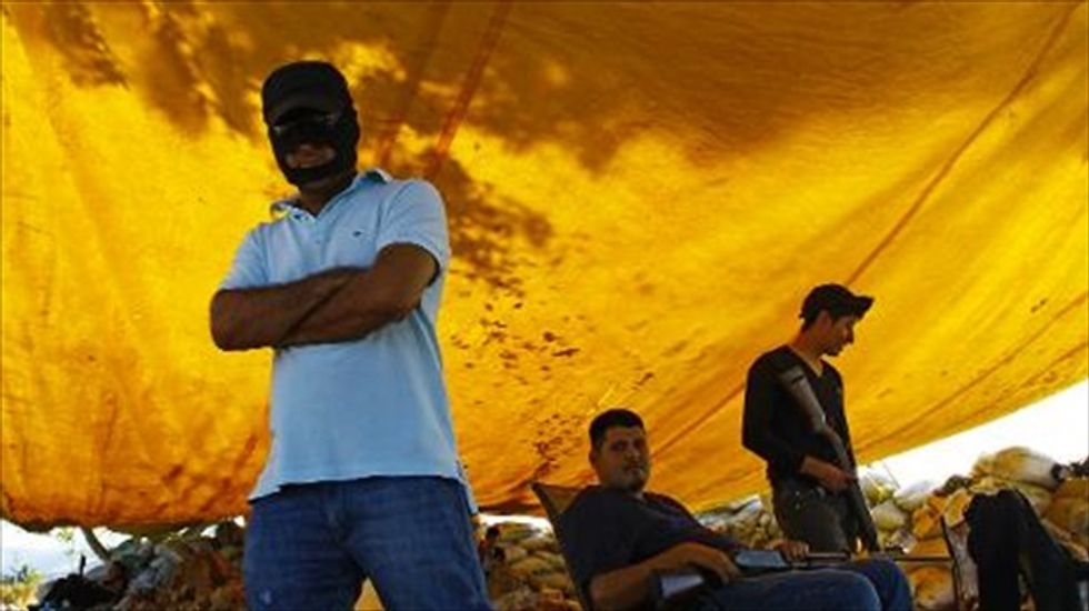 Mexican security forces seize cartel stronghold in Michoacan