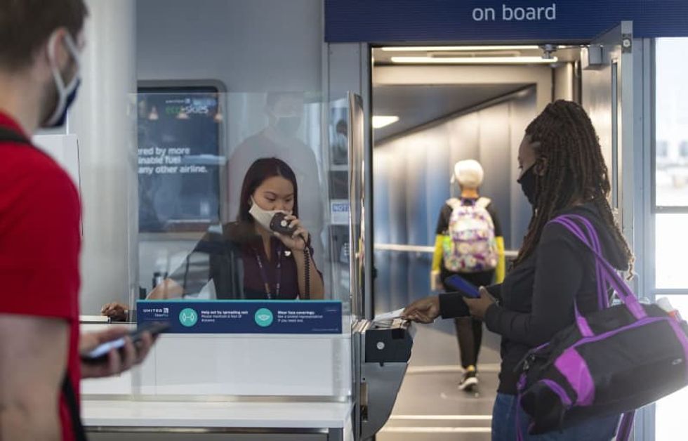 Summer air travel: Masks, a new boarding routine and bagged snacks
