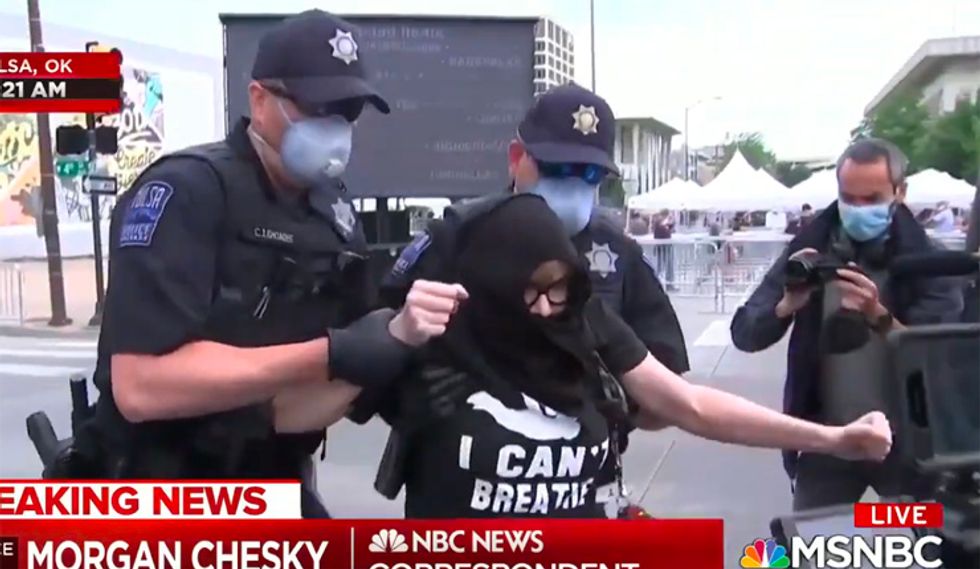 WATCH: Tulsa cops hustle away Black Lives Matter protester after Trump rally staffer tells her she's 'uninvited'