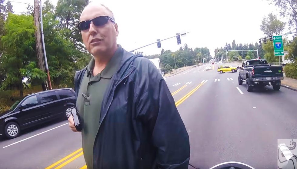 Terrifying video shows cop pulling gun on unarmed motorcyclist during routine traffic stop