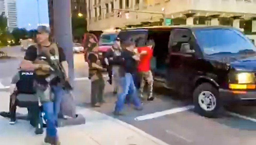Columbus 'paramilitary' police with assault weapons jump out of unmarked vans to abduct protester