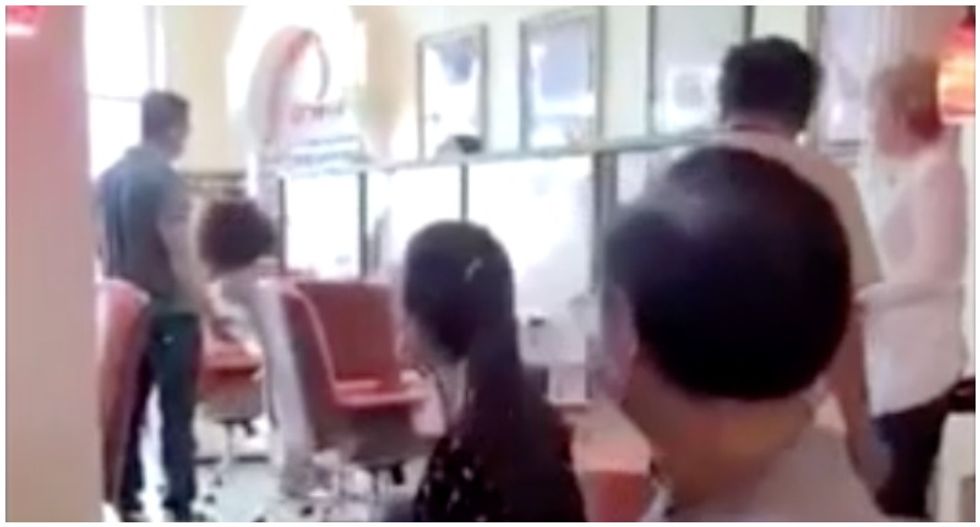 WATCH: Woman goes on anti-mask rampage at nail salon – then climbs on top of a police car