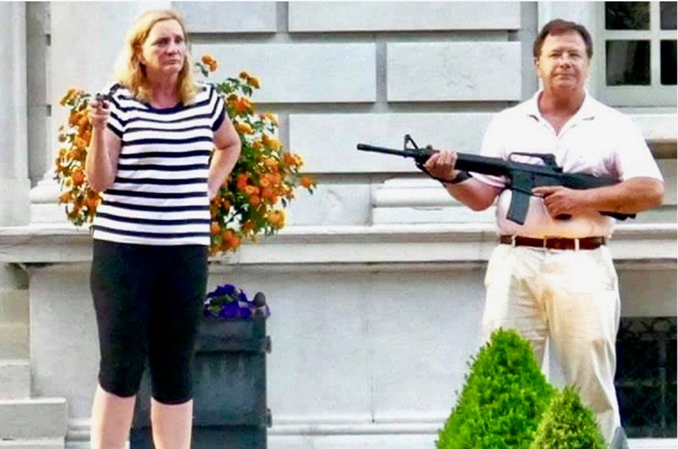 St. Louis couple who flashed guns at crowd near their mansion charged with felony: report