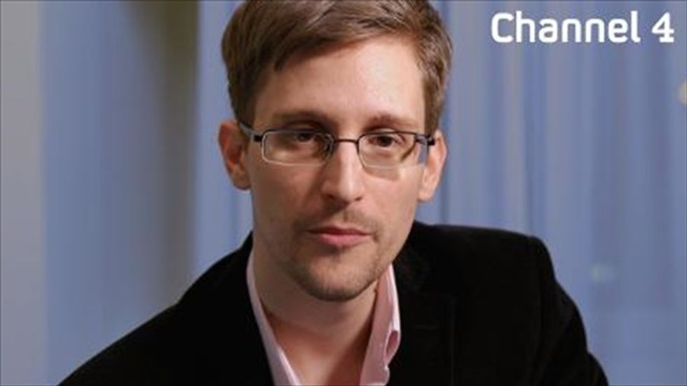 Britain denies head of its NSA equivalent is leaving because of Edward Snowden